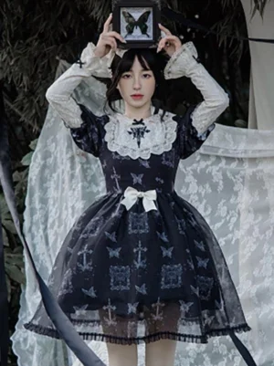 Black gothic lolita dress front view model wearing butterfly cross print white lace collar waist bow puffed short sleeves