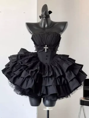 Black Gothic Lolita dress on mannequin front view showcasing boned corset bodice, short layered ruffle skirt, cross brooch detail, strapless neckline option, and structured bell-shaped silhouette