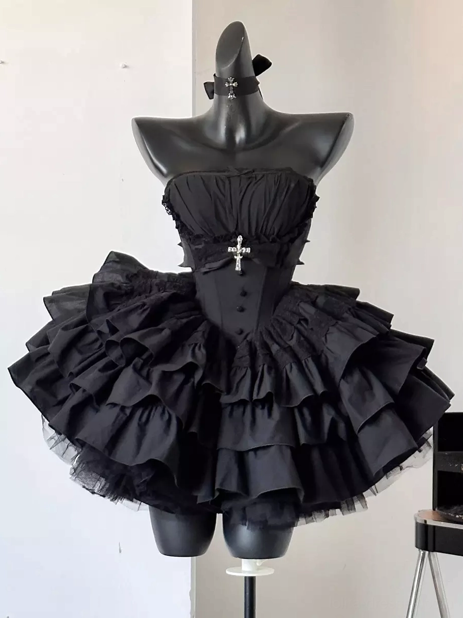Black Gothic Lolita dress on mannequin front view showcasing boned corset bodice, short layered ruffle skirt, cross brooch detail, strapless neckline option, and structured bell-shaped silhouette