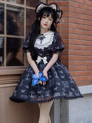 Gothic lolita dress three quarter side view model outdoor brick window puffed short sleeves long lace oversleeves white collar waist bow