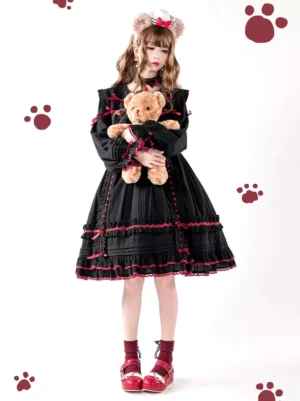 Gothic lolita black wine red OP dress front full body view with cat ear headbow and teddy bear accessory showing lace bows and ruffles