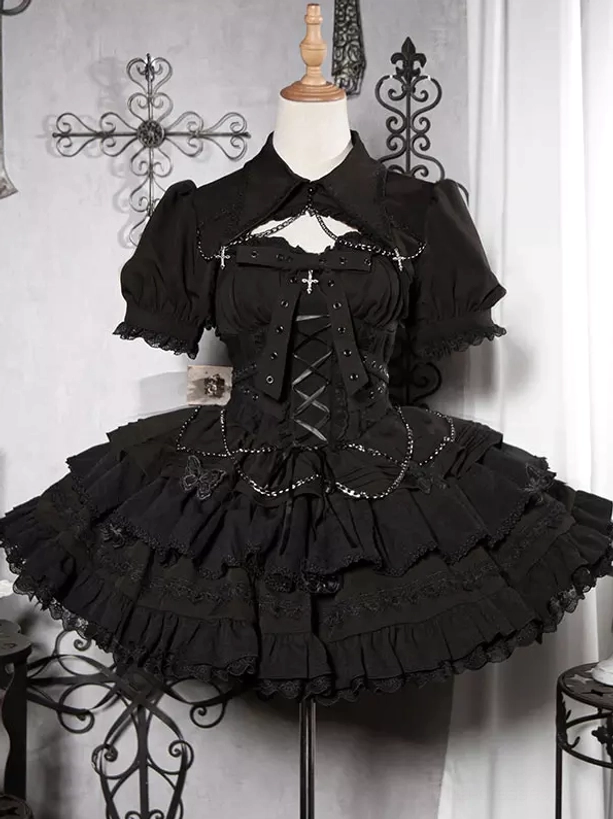 Gothic lolita jumper dress chain cross ruffles bolero set available in black and white with corset bodice sleeveless silhouette