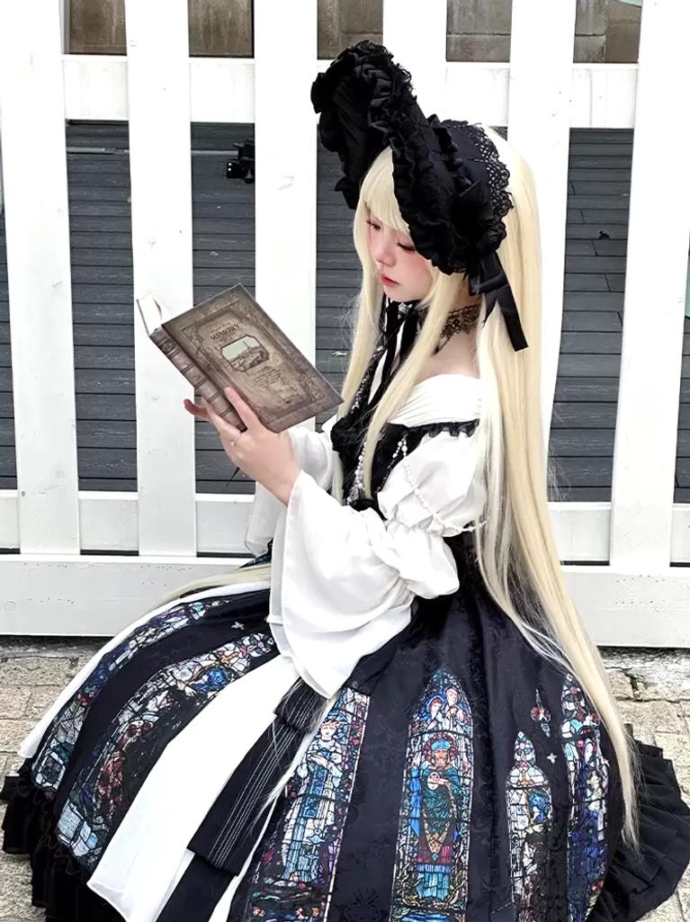 Gothic Lolita dress detail view showing lace bonnet choker necklace split bell sleeves and stained glass skirt print