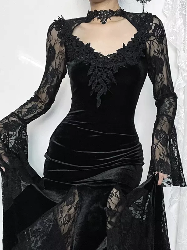 Three-quarter front close-up of gothic lolita dress showing fitted velvet bodice, sheer lace skirt overlay, and model holding dress skirt detail