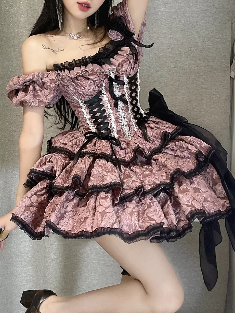 Close-up detail of Gothic Lolita dress showing off-shoulder puff sleeves, lace-up corset bodice, rose hair accessory, intricate embellishments and construction
