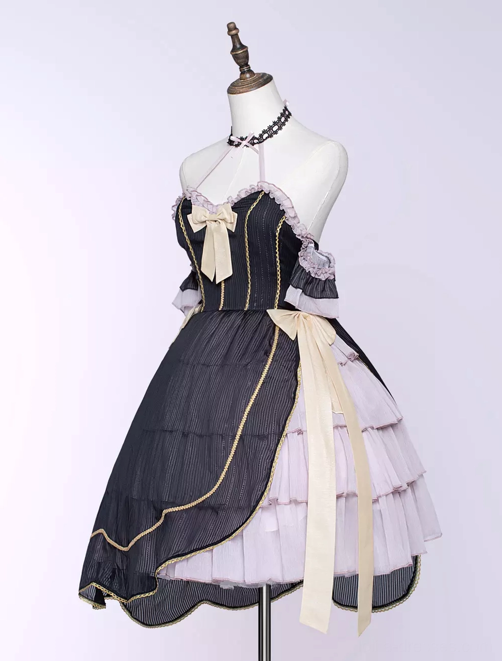 Gothic asymmetrical lolita dress close-up detail shot bow accents ruffles embellishment corset bodice craftsmanship quality construction