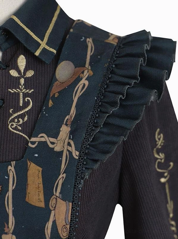 Close-up detail of Gothic Lolita dress shoulder and collar, showcasing gold embroidery, ruffled trims, and tarot printed fabric construction