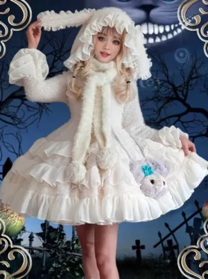 Ecru white Gothic Lolita dress with tiered ruffles front three-quarter view Halloween themed photoshoot bunny ear hood fluffy pom-pom scarf