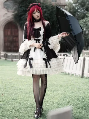 Full length gothic lolita chiffon dress color block design with multiple bows fishnet stockings and parasol accessory