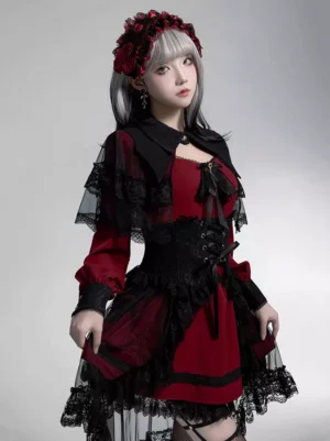 Gothic lolita dress upper body close-up featuring hollow collar, front bow decoration, ruffled lace sleeves, and lace capelet detail