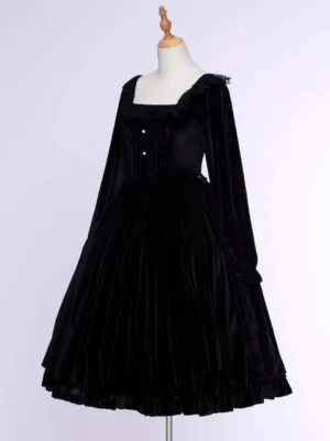 Black velvet Lolita dress close-up front view showing lace-trimmed neckline and shirred bodice detail