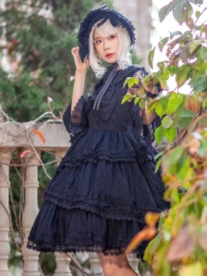 Gothic lolita dress half-body front view model wearing lace three-quarter sleeves ruffled layered skirt with neck ribbon detail