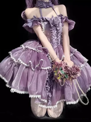 Gothic lolita dress front kneeling pose showcasing lace-up corset bodice, ruffled sleeves, tiered skirt construction, rose choker detail, and delicate white lace trim throughout