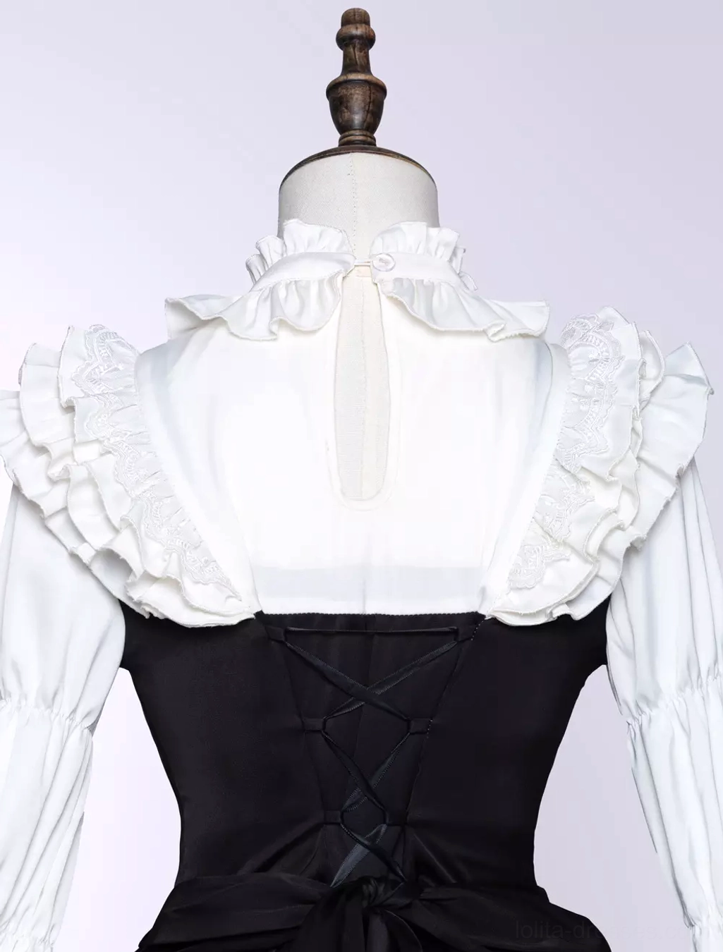 Black gothic lolita dress full skirt detail with layered ruffles, white lace accents, and dramatic volume silhouette for authentic lolita aesthetic