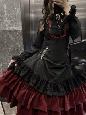Gothic lolita long sleeve dress close-up upper body corset bodice with chain brooch burgundy lining marble elevator wall background