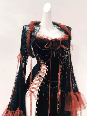 Close-up detail of Gothic Lolita dress red rose ornament and decorative chain tassel with corset lacing side straps