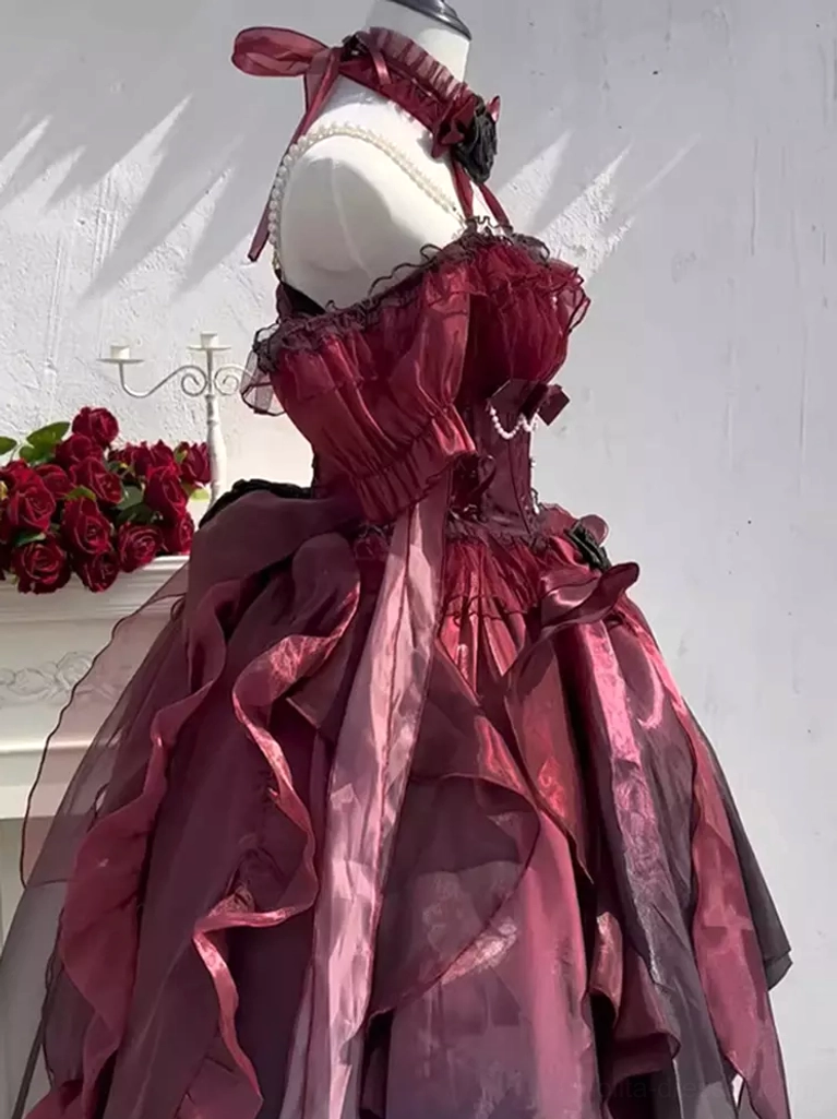 Gothic Lolita dress side close-up view showing fitted corset waist, shiny organza fabric and layered ruffled architectural details