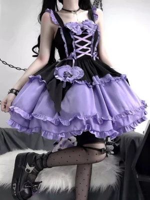 Purple-black Gothic Lolita dress side profile showing layered ruffle hem, model wearing dotted stockings and platform boots, close-up detail shot