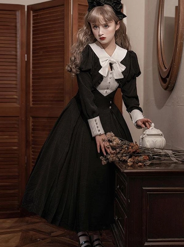 Gothic Lolita dress full-body side view long dark skirt white bow collar with dried florals