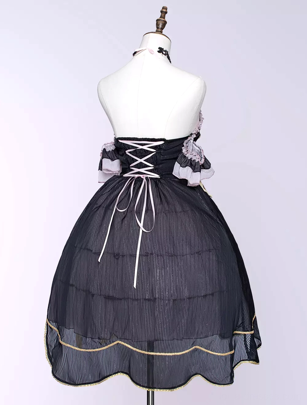 Gothic lolita dress layered tulle skirt detail view asymmetrical hemline ruffle construction texture premium polyester fabric quality