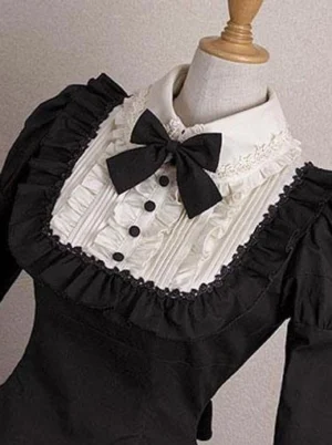 Gothic Lolita dress upper detail close-up white peter pan collar with pleated chest front black bow black buttons ruffled trims