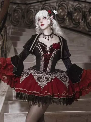 Gothic lolita dress front three-quarter view showing velvet bolero jacket embroidered corset details and tulle tutu skirt with lace hem