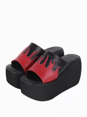 Gothic lolita flame platform sandals paired top-down view showing bold red-black color block design with flame appliqué motif and rivet details