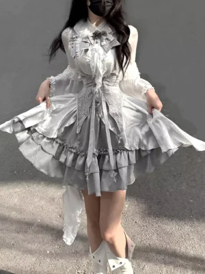 Gothic Lolita two-piece dress set front view on model with flared lace sleeves and tiered ruffled grey skirt outdoor street setting