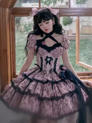Gothic Lolita dress with cross halter neckline, floral print pattern, black lace trims, and decorative head bow accessory, model in window indoor setting