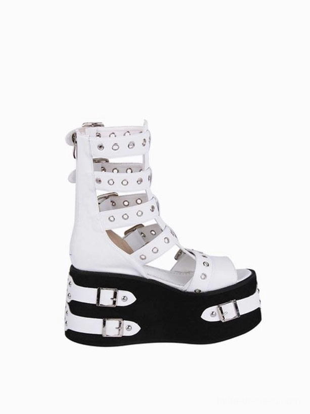 Single Gothic Lolita platform gladiator sandal left side profile view displaying tall studded ankle straps, open toe opening, and black wedge sole with silver fasteners