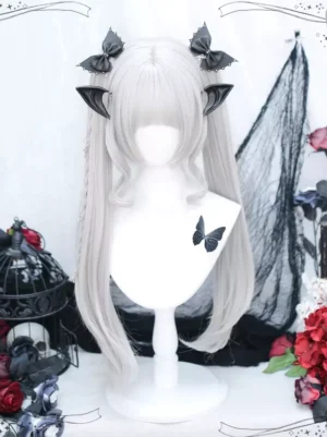 Gothic Lolita gray long wig with blunt bangs and curled twin tails styled on mannequin with gothic retro decor and black hair accessories