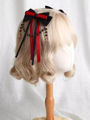 gothic lolita hair bow clip rear three-quarter angle dual-tone ribbon streamers beaded cross charm tassels on wig mannequin