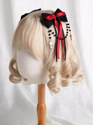gothic lolita single hair bow clip with beaded chain cross pendant left front view on blonde wig mannequin black red lace ruffles