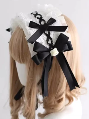 Side profile view of Gothic Lolita headband featuring crossed black ribbon decoration, large satin bows with cream flower ornament, and intricate lace details on model