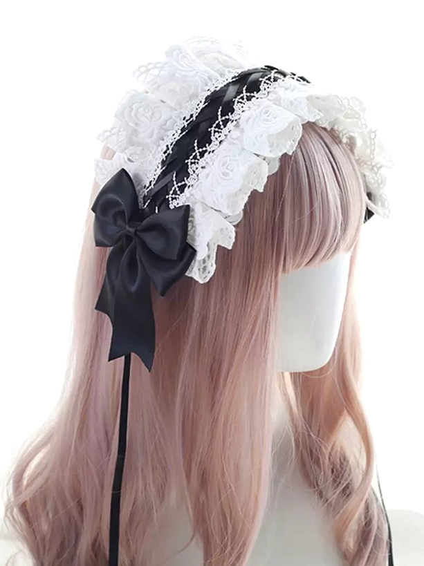 Gothic Lolita lace headband with white ruffled lace and sophisticated black satin bow, black ribbon strip accents, styled on mannequin with pink wavy hair, three-quarter front view showcasing gothic aesthetic