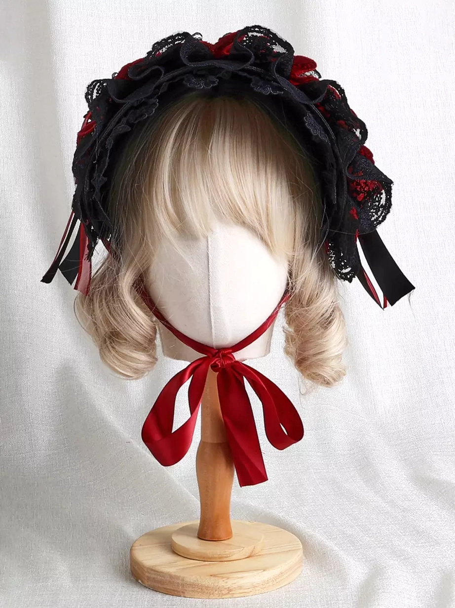Gothic Lolita lace-up bonnet front facing view displaying ruffled lace brim, red chin tie strap, side ribbon straps, and full two-tone design