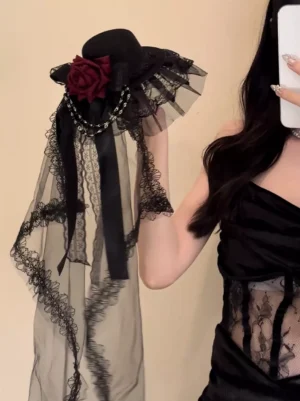 Gothic Lolita headdress with red rose and black lace veil displayed on model wearing black camisole dress, featuring silver chain details and side handheld product view