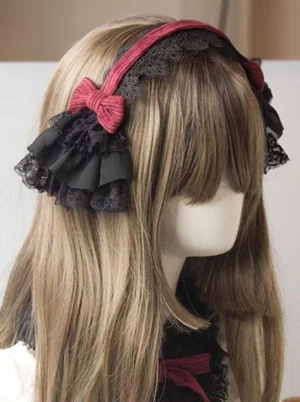Gothic Lolita headdress in wine red and black with layered lace ruffle and wine red bow, shown from right lateral rear view on mannequin with light brown wig, demonstrating the intricate two-tone design and delicate lace construction