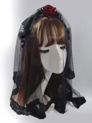 Black Lolita head veil left side profile showing lace-edged tulle and red floral rose ornament on model with brown wig