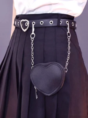 Gothic lolita heart waist bag front close-up view with silver heart buckle and detachable mini pouch worn with black pleated skirt