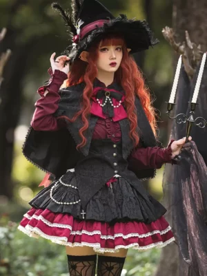 Gothic lolita jacquard suspender skirt in wine red and black with layered ruffles and grommet details, front view on model with forest background
