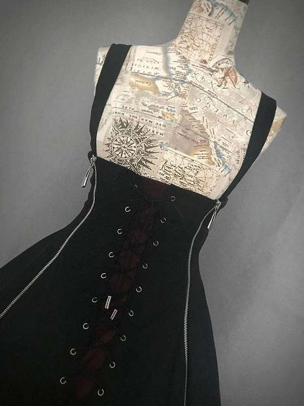 Close-up detailed view of black red gothic lolita JSK front lace-up panel with metal eyelet fasteners and dual side zippers