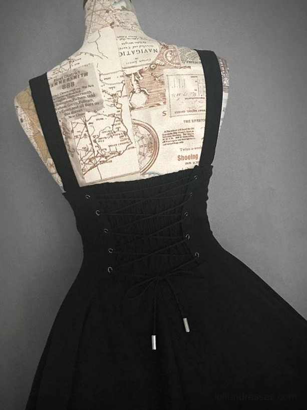 Black red gothic lolita JSK jumper skirt back view displaying corset lace-up back panel with metal eyelets and decorative strap tips