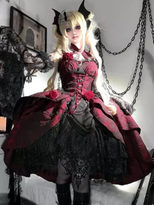 Burgundy and black Gothic Lolita JSK dress with jacquard rose appliqués front view worn by blonde model with devil horn ornaments showing corset bodice and layered ruffle skirt