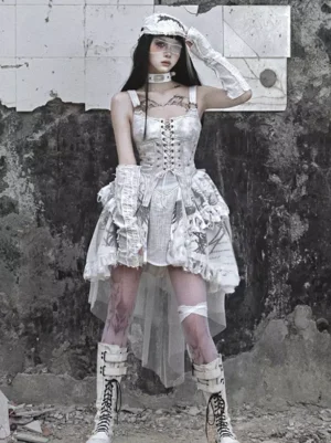 Gothic lolita jumper skirt dress showing high-low asymmetrical hemline with printed fabric texture and layered ruffled tulle, three-quarter angle with model posing outdoors