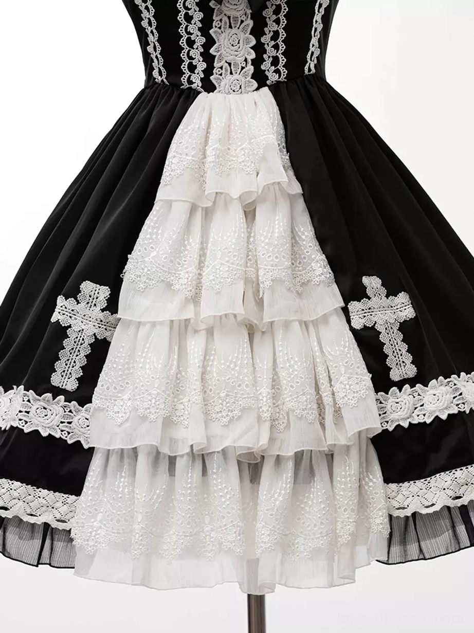 Lifestyle photography of gothic lolita JSK dress worn at tea party or lolita event setting, showing practical wearability and aesthetic impact