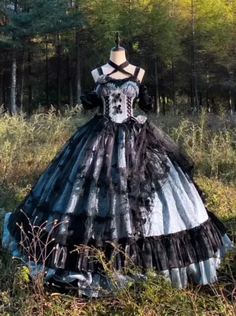 Back detail of gothic Lolita JSK gown showing black satin bow and rose decorations with lace accents
