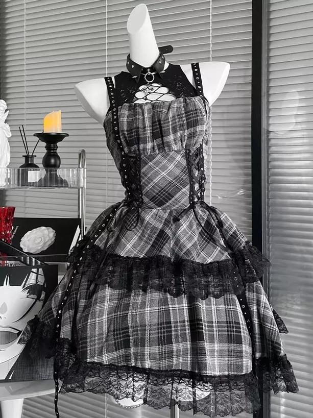 Grey and black plaid gothic lolita JSK dress front three-quarter view featuring halter cutout neck, attached gothic choker, lace-up front with rivets, and ruffled lace hem