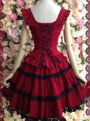 Gothic Lolita red black jumper skirt back view showing lace up closure ruffled shoulder straps black lace trim details sleeveless JSK