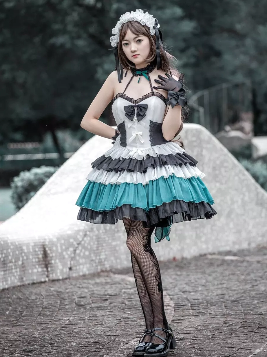 Gothic Lolita JSK sleeveless tiered ruffle dress side front view model wearing black gloves layered ruffles